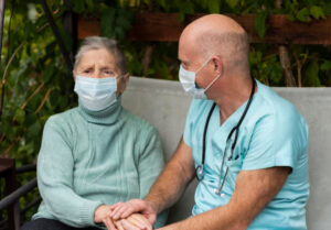 Family caregiver resting while hospice nurese provides respite care support in Burbank and Pasadena